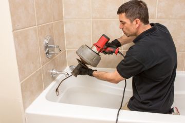 Joshua's Plumbing & Drain Cleaning Snaking a Clogged Drain in Forest Lake